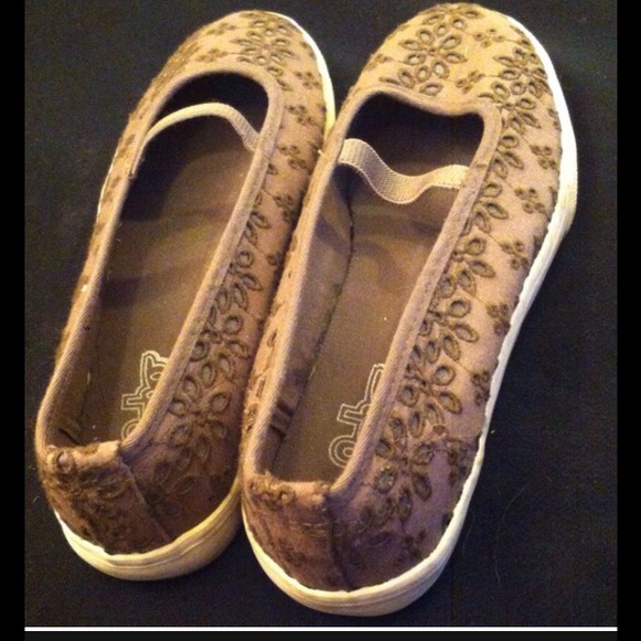 Brown flowery flats