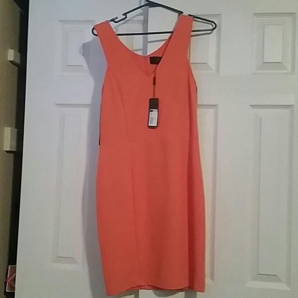 Orange v-neck Kim Kardashian dress