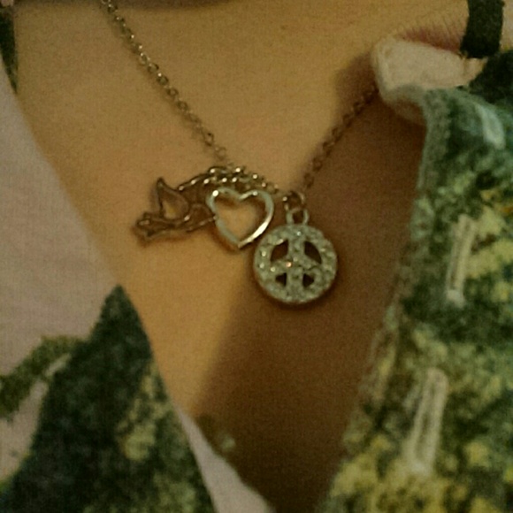 Bird, heart and piece sign necklace.