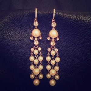 Pearl and diamond earrings.