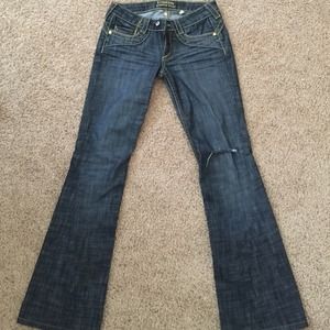 BEBE jeans with gold embellishments