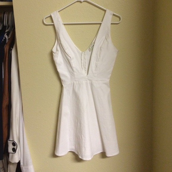 Super cute low cut bright white dress.