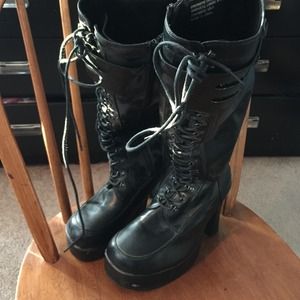 Tall black combat boots with heel