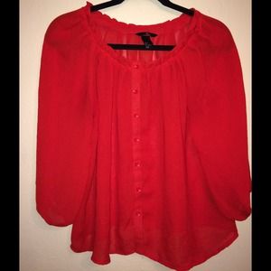 Red flowy blouse.