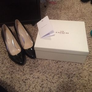 Black patent coach pumps