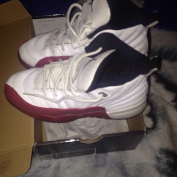 Jordan retro 12s red white and black.