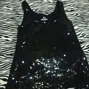 Sequined tank top. Black in color.