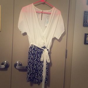 White and black romper. Never been worn.