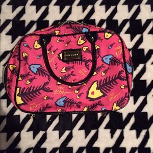 Betsey Johnson bad to the bone weekender bag.