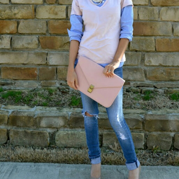 Large pink envelope clutch.