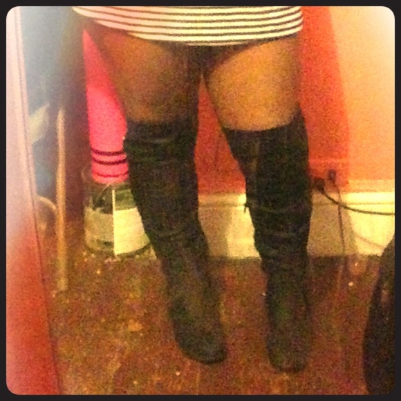 Black leather high riding boots