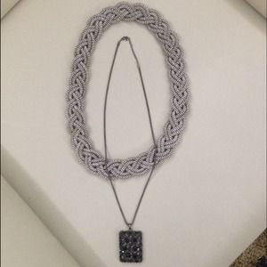 Silver necklace and black necklace