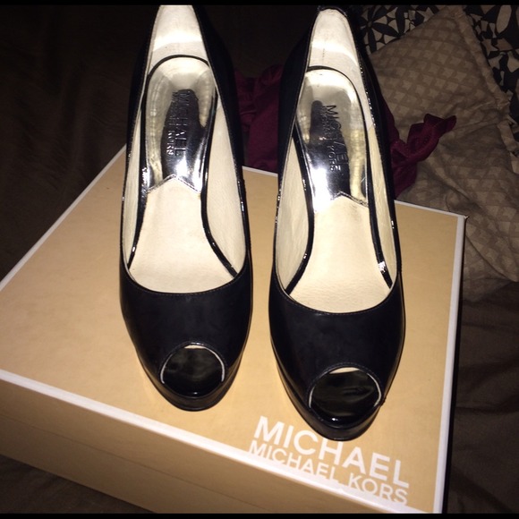 Worn once pair of patent leather MichaelKors heels