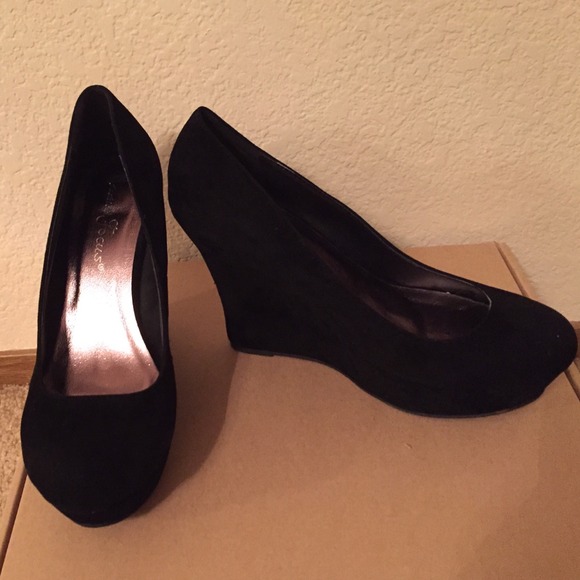 Black suede closed-toe wedges