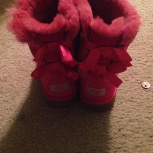 UGG boots . Pink ribboned.