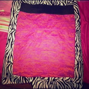 A pink skirt with a floral print