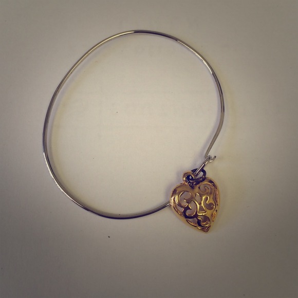 Silver bangle with gold heart charm