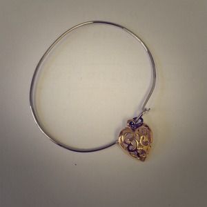 Silver bangle with gold heart charm