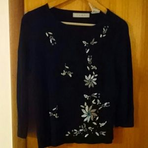 Black knit top embellished with floral beading