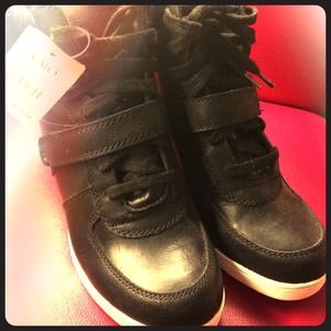 Black faux leather wedge sneakers