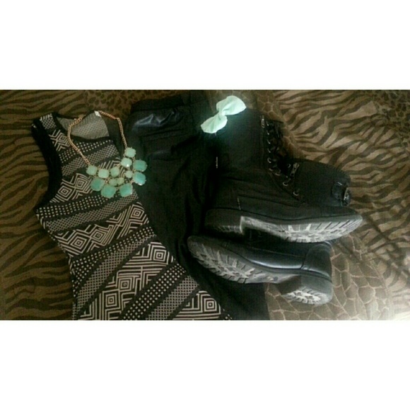 peplum top, leather pants, combat boots.