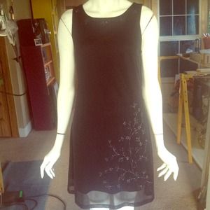Sweet little black dress with glitter detail
