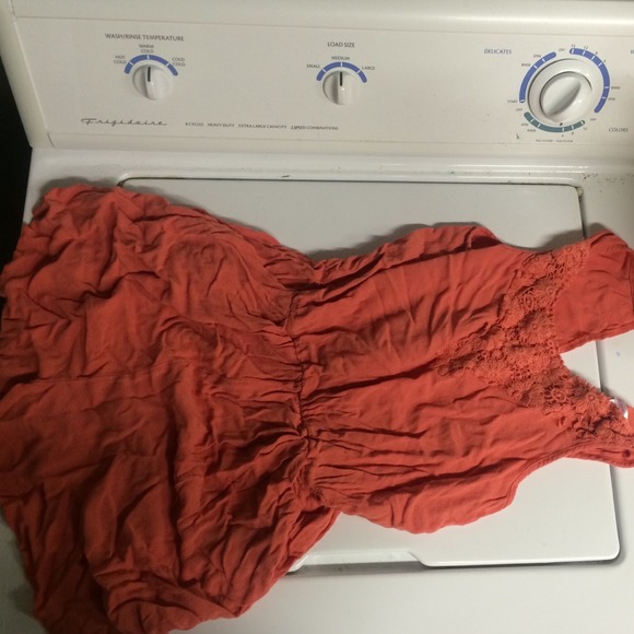 Orange/coral romper.