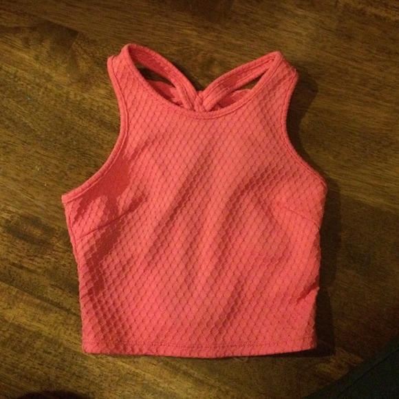 Pink crop top with crossed back and a bow