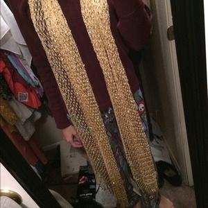 Gold sparkly scarf.