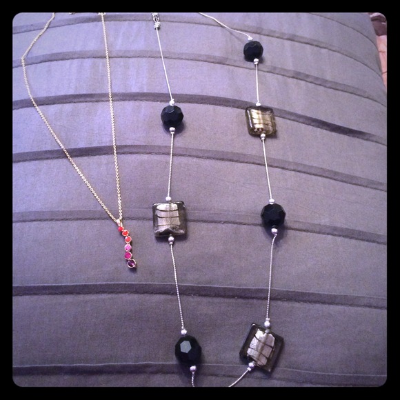 1 gold colored with colored gems the other is silv