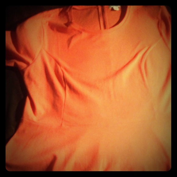 Orange peplum with zipper in back