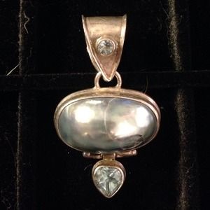 Sterling silver and fresh water pearl pendant.