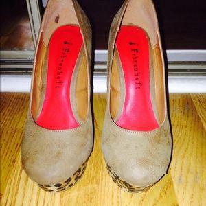 Womans brown leather shoes with a leopard wedge