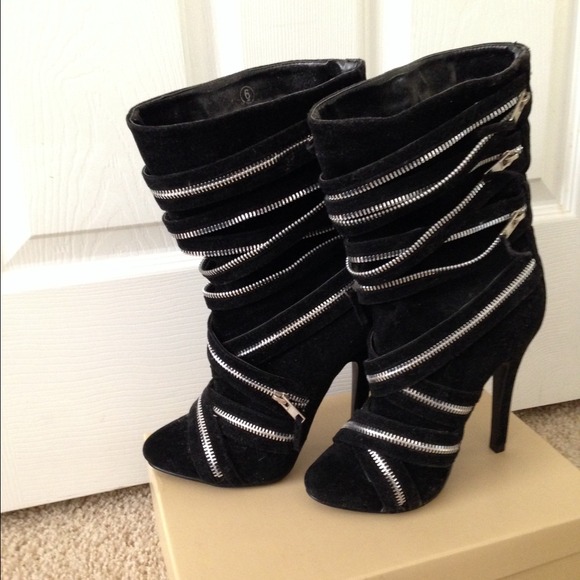 Black zippered boots.