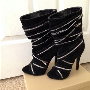 Black zippered boots.