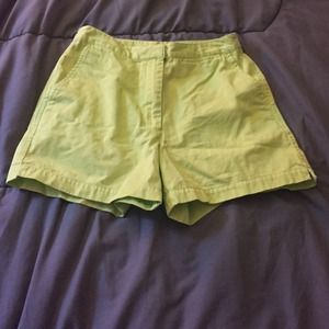 Lime green high waisted shorts.