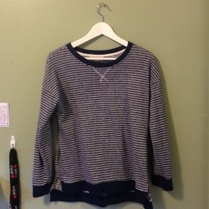 Dark blue, with thin white stripes sweater.