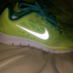 Green and blue nike shoes