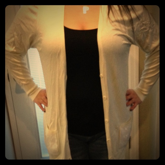 Plus size cream button down sweater.