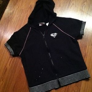 Black sleeveless hoodie with silver supergirl logo