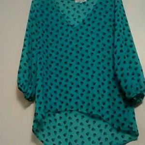 A sheer mint shirt with skulls