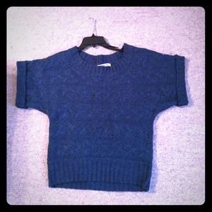 Cuffed, short sleeved. Deep blue sweater