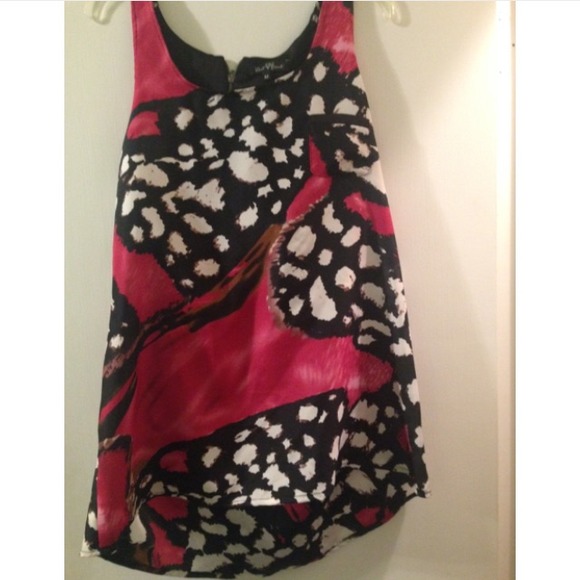 Razor back , sleeveless blouse.