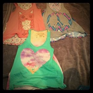 3 slight high-low tank tops.