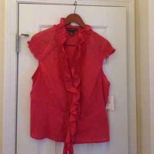 Rust colored sleeveless blouse