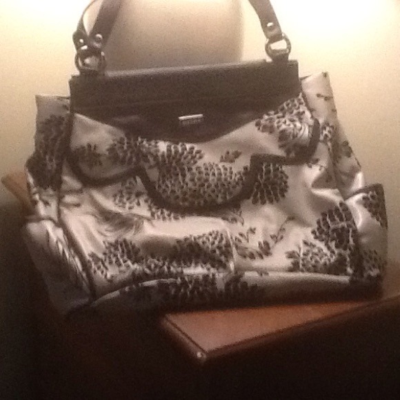 Black and off white huge handbag.