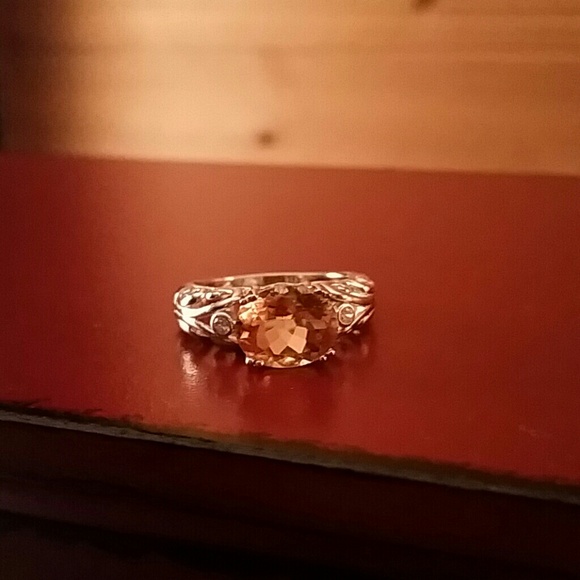 topaz with white gold band & two dimonds .