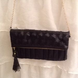 Black woven flap clutch or side purse.