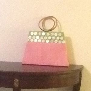 A pink and green resort hand bag