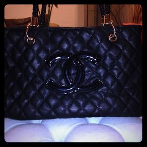 Solid black quilted bag